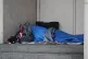 A homeless person sleeping rough in a doorway, February 7, 2