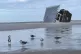 A lifeguard hut rests on its side after Hurricane Milton, Oc