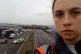 A Just Stop Oil protester on a bridge over the M25
