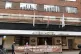 Spied on campaigners hold up banner outside amba hotel in ma
