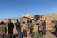 Palestinians look on as a bulldozer approaches their homes