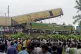 Onlookers watch as rescuers work after a cargo train rammed 