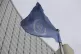 The flag of the International Atomic Energy Agency flies in 