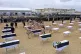 Mourners prepare to bury the remains of Yazidi victims in a 