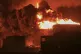 Oil tanks burn at the port in Hodeidah, Yemen, July 20, 2024