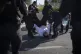 Israeli police officers remove an ultra-Orthodox Jewish man 