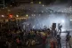 Police use water cannon to disperse demonstrators during a p