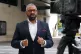 Home Secretary James Cleverly speaking to the media outside 