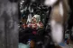 A vendor sleeps on a hot afternoon at her shop at Market 4 i