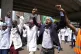 Doctors and other medical staff take part in a protest, in d