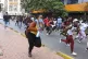 Demonstrators run from police during a protest over proposed