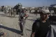 Palestinians flee the Khan Younis area of the Gaza Strip, Au