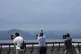 Visitors use binoculars to see the North Korean side from th