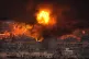 Flames rise after an Israeli airstrike in the southern subur
