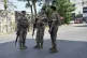 Lebanese security stand guard on a road that leads to the U.