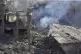 Rescue workers search for victims at the site that was hit b