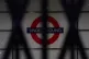 Sign for the London Underground seen through the closed shut