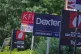 Estate agent signs outside apartments in Lewisham, south-eas