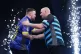 Luke Littler (left) embraces Rob Cross after winning night t