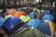 Haitian migrants camp out at Giordano Bruno plaza in the Jua