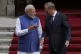 Indian Prime Minister Narendra Modi (left) is greeted by his