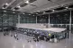 Passengers arrive with their luggage at a Lufthansa check-in