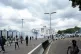 People run away from tear gas during a protest on the street