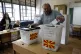 A man casts his ballots for the parliamentary election and t