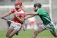 Loughgiel Shamrocks’ Liam Watson (left) and Coolderry’s 