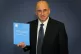 Lord Justice Leveson with the Report from the Inquiry into t