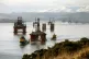 An oil rig is moved with tug boats down the Cromarty Firth n