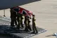 Soldiers carry the coffin of Trooper Carl Smith, 23, who was