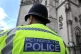 A Met police officer outside royal court of justice
