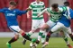 Celtic's Aidan Mcilduff (centre) battles for the ball with R