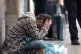 A homeless person outside Victoria Station in London