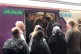 Commuters at Bolton train station try to stuff themselves in
