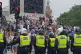 Police watch supporters of Tommy Robinson during their prote