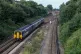 A Northern Rail train travels through Hunts Cross Station in