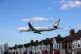 A Cathay Pacific Boeing 777 plane lands at Heathrow Airport 