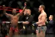 Leon Edwards (left) celebrates beating Gunnar Nelson in acti