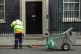 A cleaner outside 10 Downing Street