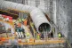 Workers construct reinforced steel around giant water coolin