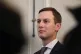 Jared Kushner listens as Donald Trump holds a breakfast meet