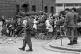 Women and children lean against a barricade on Davis Street 