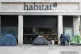 Homeless people's tents erected outside a furniture store in