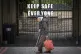 A pensioner walks past a sign that reads 