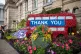 A gardener puts the finishing touches to a floral display th