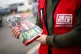 A vendor selling The Big Issue magazine
