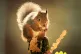 A red squirrel forages for food among autumn leaves in the W