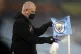 Ground staff disinfect the corner flag at half time during t